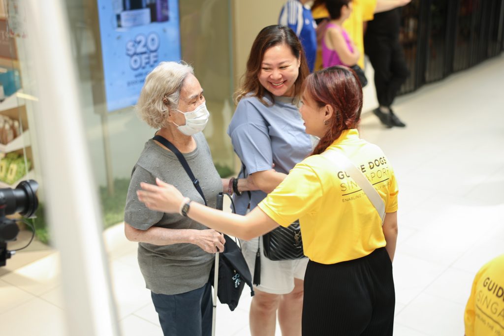 GDS staff talking to GDS client and her caregiver.