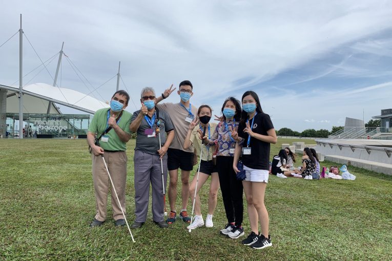 Group photo of GDS clients and volunteers at Marina Barrage.