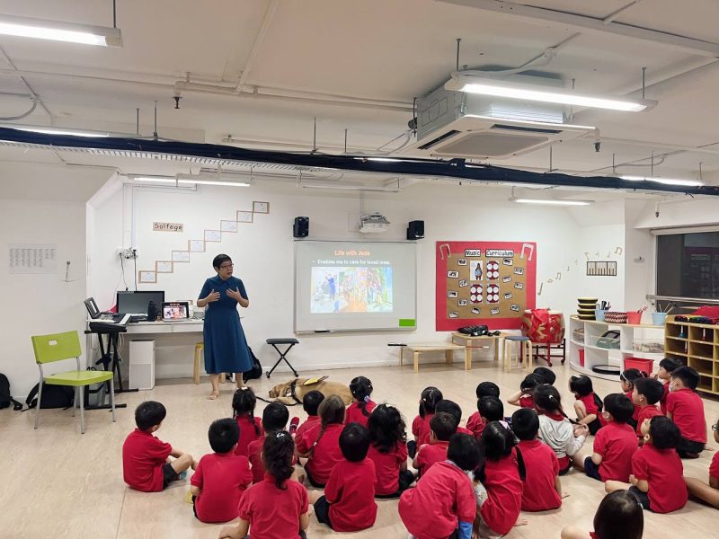 guide dog user sharing her journey of vision loss with a group of preschoolers.