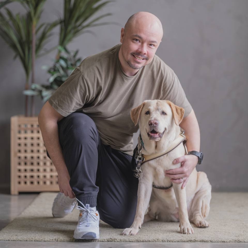 Jeremy Ng with guide dog Clare Mr. John Shum and guide dog Laurie
