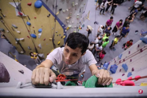 A top-down view of a GDS client climbing a rock wall