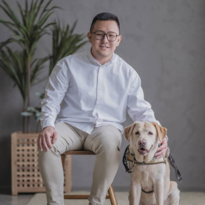 Kelvin Ang, Social Worker and guide dog Clare Chia Hong Sen, IT Trainer and Consultant, with his guide dog Clare