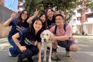 The team from NTU poses with guide dog team Thomas and Eve